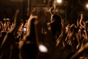 crowd-people-with-raised-arms-having-fun-music-festival-by-night